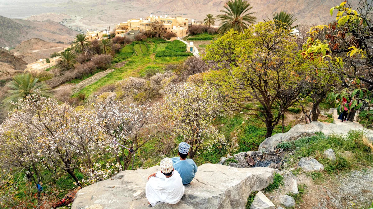 25d3f3b2d553-Boys-looking-onto-the-oasis-of-Wakan-Ministry-of-Heritage-Tourism-Sultanate-of-Oman Boys looking onto the oasis of Wakan Ministry of Heritage Tourism Sultanate of Oman