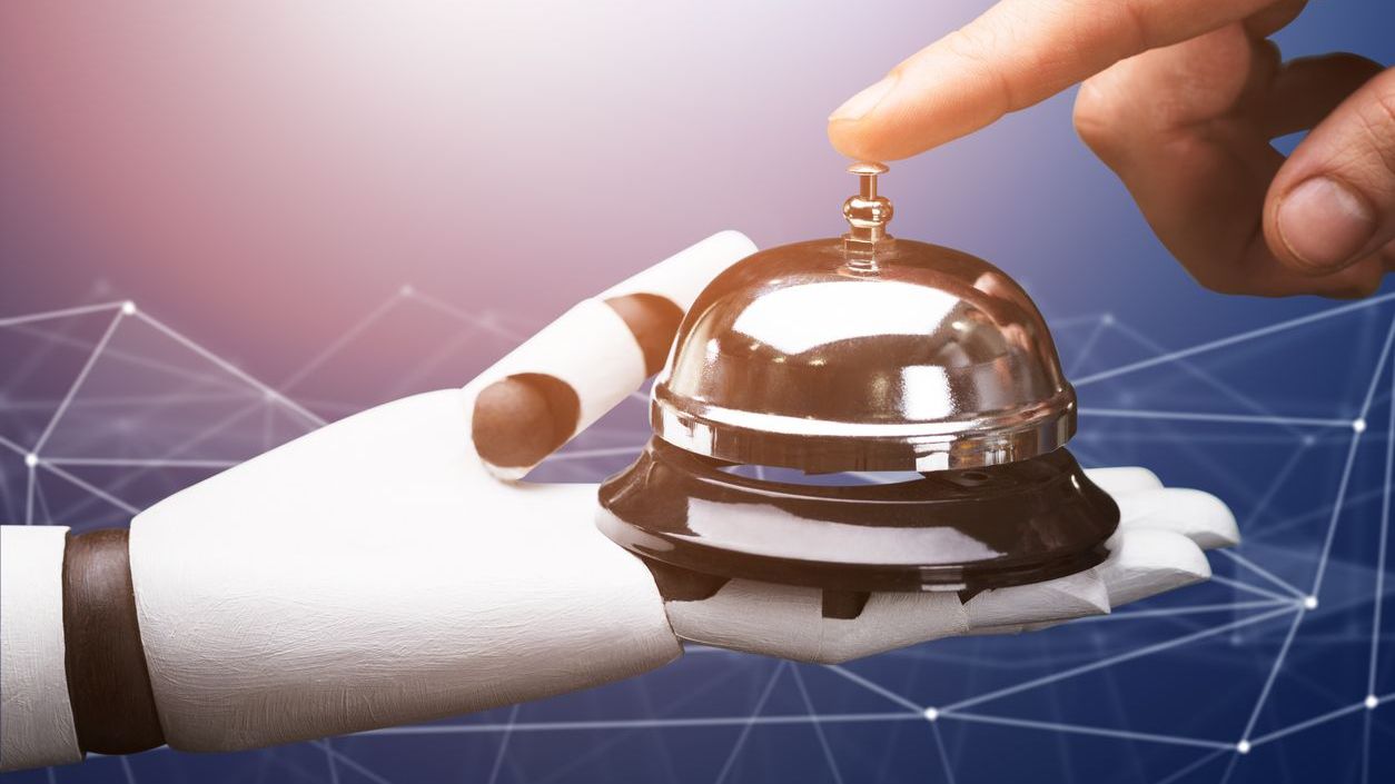KI Hotel Rezeption Roboterhand Empfangsklingel